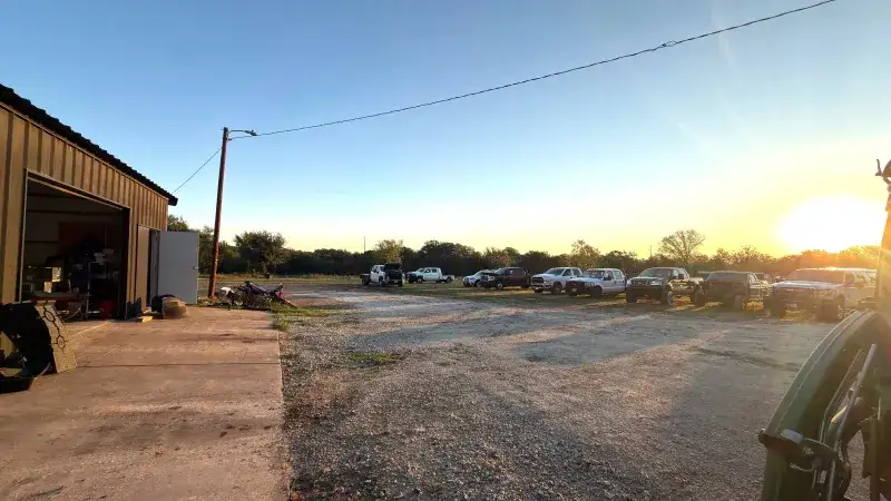 Sunset over the gravel lot at Young Motorsports in Alvarado, Texas